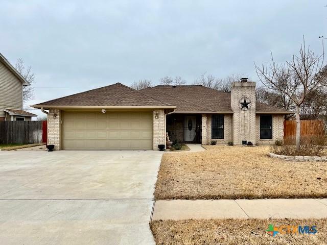 ranch-style house featuring a garage