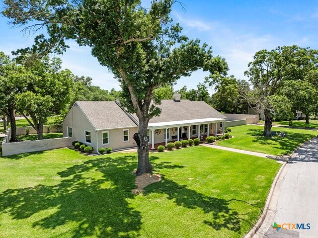 707 W Thompson Ave, Temple, TX 76501 - view of front of home featuring covered porch and a front yard