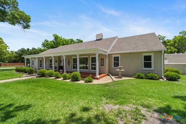 707 W Thompson Ave, Temple, TX 76501 - view of front of property with a chimney, brick siding, and a shingled roof
