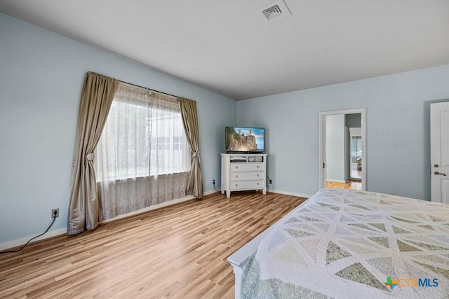 707 W Thompson Ave, Temple, TX 76501 - bedroom featuring wood finished floors and baseboards