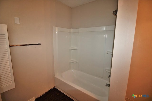 bathroom with shower / tub combination