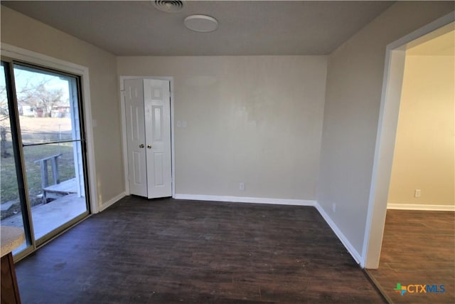 empty room featuring dark hardwood / wood-style floors