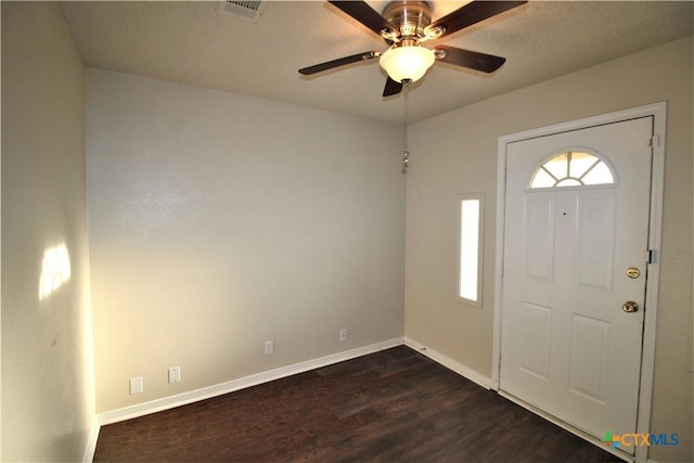 foyer entrance featuring dark hardwood / wood-style floors and ceiling fan