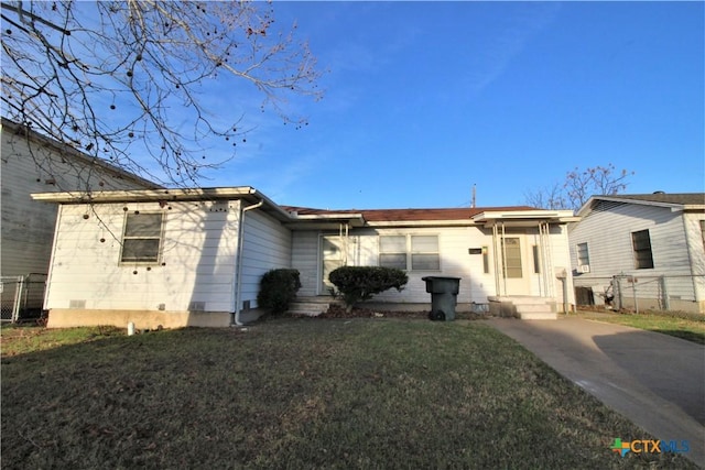 back of property featuring a lawn