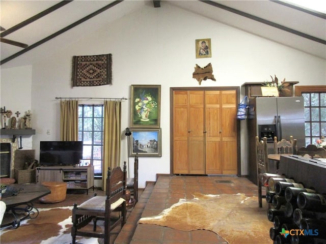 1004 Daviot Dr, Briarcliff, TX 78669 - living room featuring high vaulted ceiling, beamed ceiling, and tile patterned floors