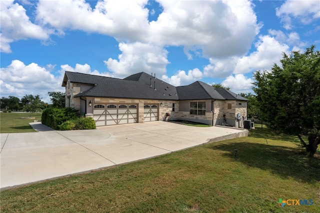 exterior space featuring a garage and a front lawn