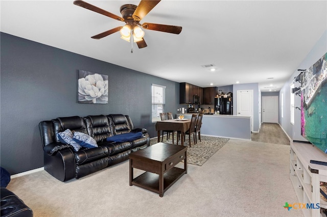 12 Trinity Cir, Lockhart, TX 78644 - living room with light colored carpet and a ceiling fan