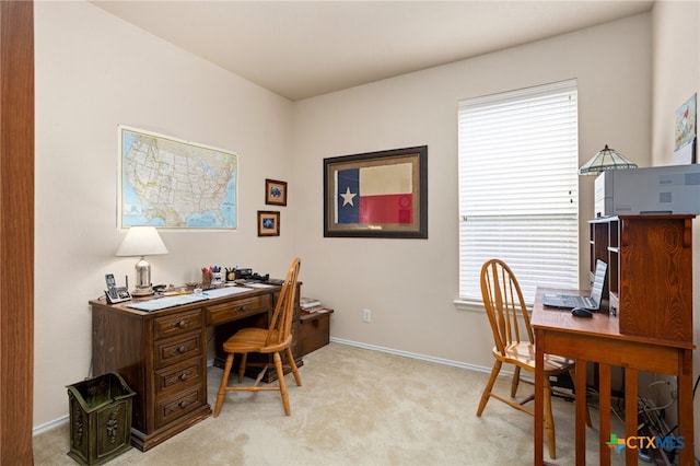office area featuring light colored carpet and healthy amount of natural light