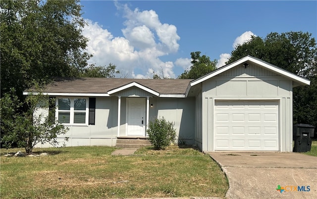 ranch-style house with a garage and a front yard