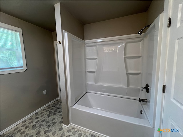 bathroom featuring tile patterned flooring and shower / washtub combination