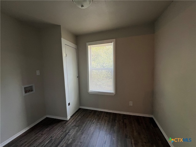 empty room featuring dark hardwood / wood-style floors