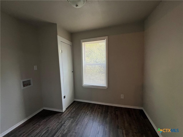 908 S 22nd St, Temple, TX 76501 - empty room featuring dark wood finished floors and baseboards