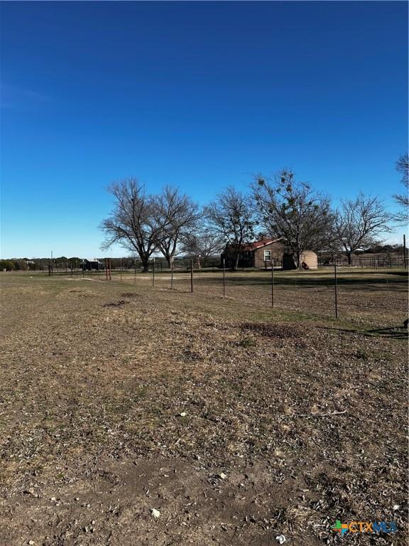 view of yard with a rural view