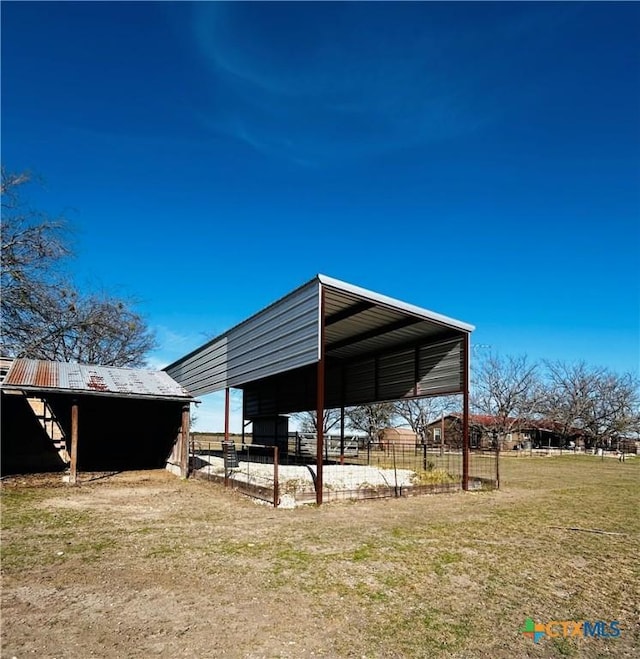 view of outbuilding featuring a lawn