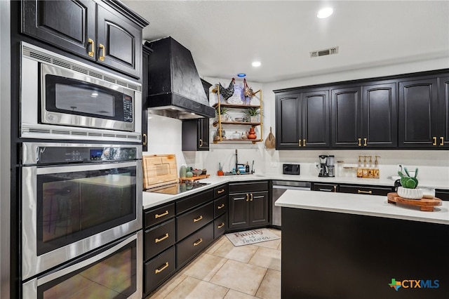 kitchen featuring custom range hood, stainless steel appliances, sink, and light tile patterned floors