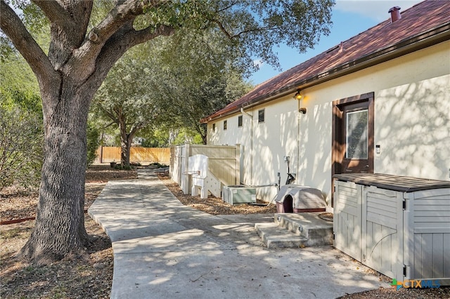 view of side of home featuring a patio area