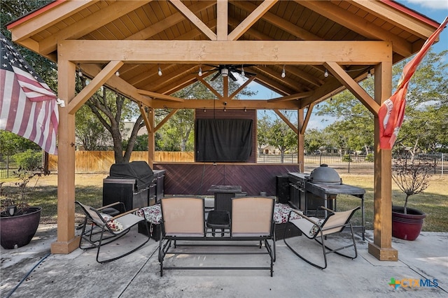 view of patio featuring ceiling fan, a grill, and a gazebo