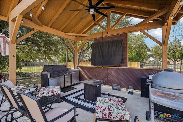 view of patio / terrace with a grill, ceiling fan, an outdoor fire pit, and a gazebo