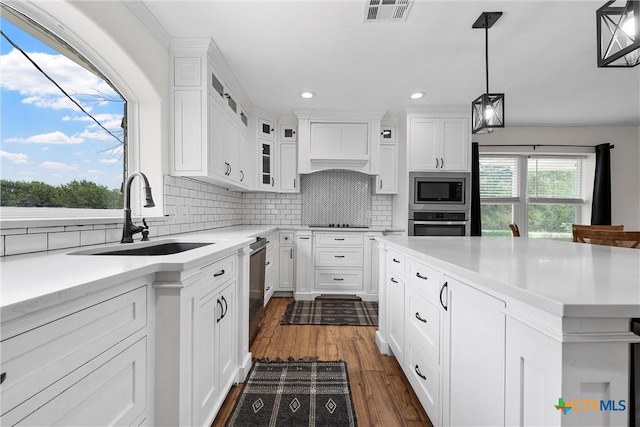 7031 Steinbeck Bend Dr, Waco, TX 76708 - kitchen with stainless steel appliances, light countertops, white cabinetry, and recessed lighting