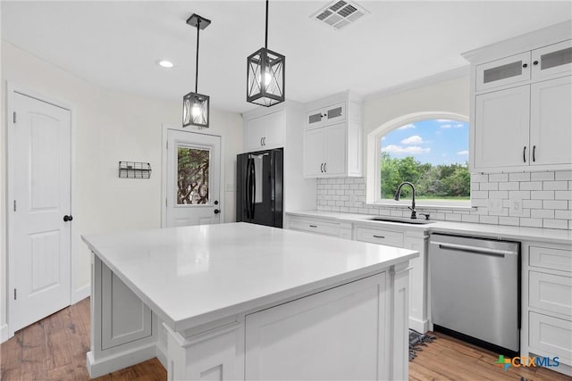 7031 Steinbeck Bend Dr, Waco, TX 76708 - kitchen with dishwasher, freestanding refrigerator, tasteful backsplash, light countertops, and recessed lighting