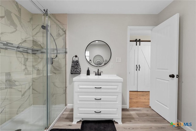 7031 Steinbeck Bend Dr, Waco, TX 76708 - full bathroom featuring a marble finish shower, vanity, and wood finished floors