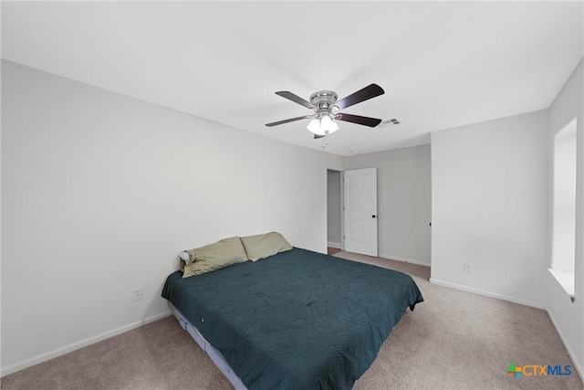 7031 Steinbeck Bend Dr, Waco, TX 76708 - carpeted bedroom featuring baseboards and a ceiling fan