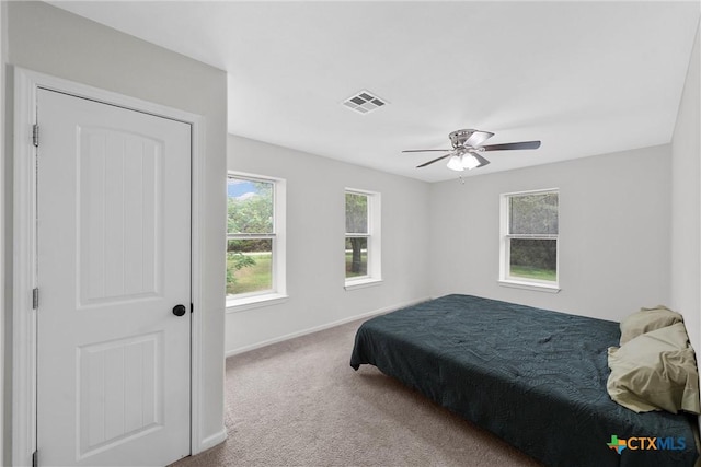 7031 Steinbeck Bend Dr, Waco, TX 76708 - carpeted bedroom with baseboards and a ceiling fan