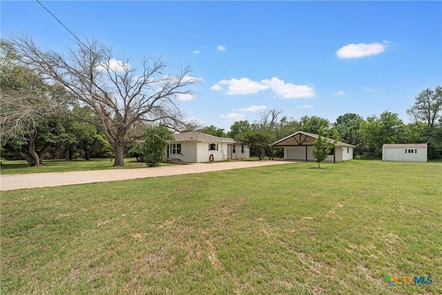 7031 Steinbeck Bend Dr, Waco, TX 76708 - view of front of home with an outdoor structure, concrete driveway, a front yard, and a carport