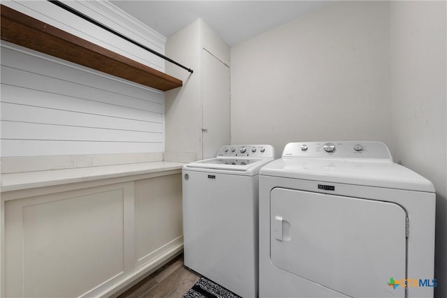 7031 Steinbeck Bend Dr, Waco, TX 76708 - laundry area with washing machine and clothes dryer and wood finished floors