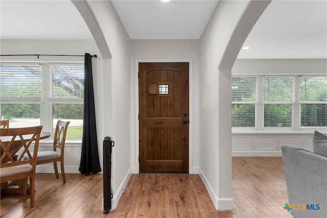 7031 Steinbeck Bend Dr, Waco, TX 76708 - foyer entrance featuring arched walkways and healthy amount of natural light