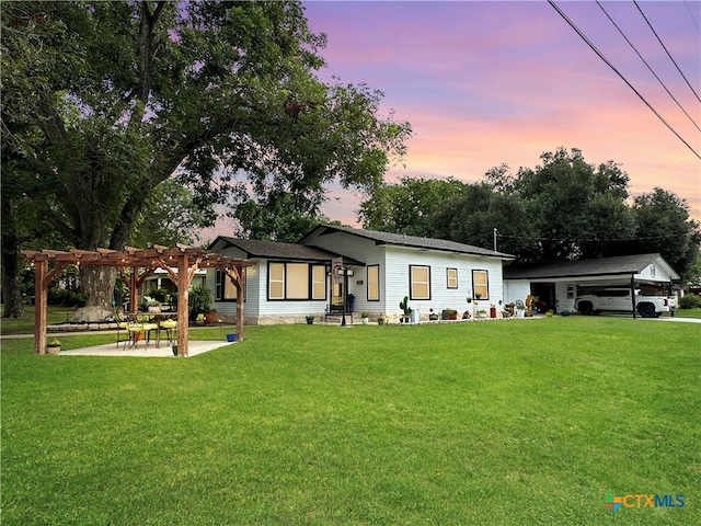 view of front of home featuring a pergola and a lawn