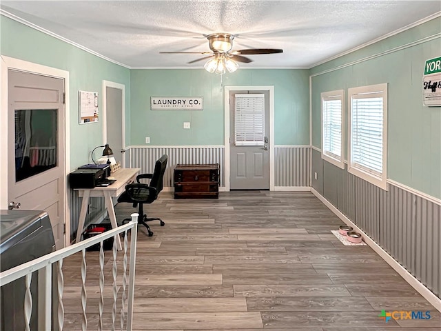 office with ornamental molding, hardwood / wood-style floors, a textured ceiling, and ceiling fan