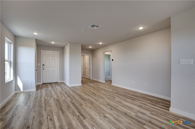 spare room featuring light hardwood / wood-style floors