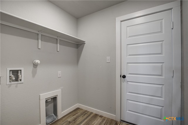 laundry room with dark hardwood / wood-style floors, hookup for a washing machine, and hookup for a gas dryer