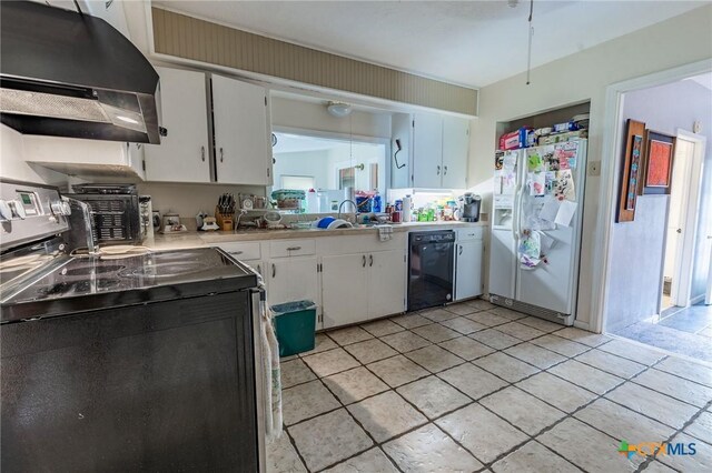 216 Prospect St, Seguin, TX 78155 - kitchen featuring white refrigerator with ice dispenser, white cabinetry, under cabinet range hood, dishwasher, and stainless steel electric range oven