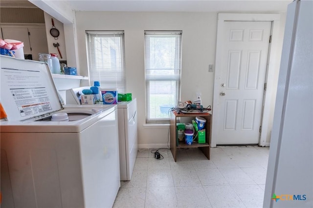 216 Prospect St, Seguin, TX 78155 - laundry room with washer and dryer, laundry area, plenty of natural light, and baseboards