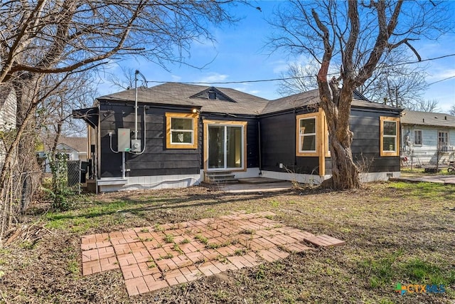 rear view of property featuring a patio area