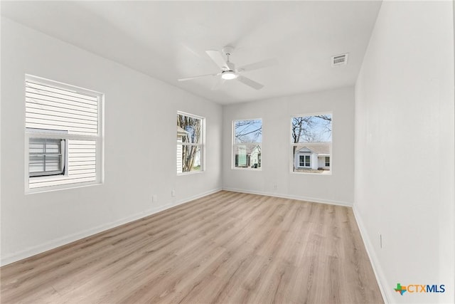 empty room with light hardwood / wood-style floors and ceiling fan