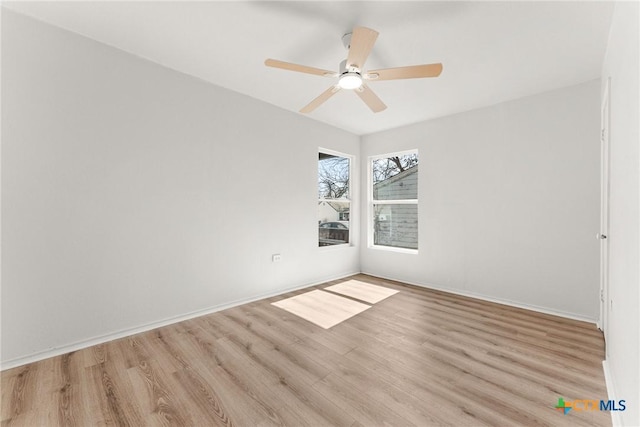 unfurnished room featuring ceiling fan and light hardwood / wood-style flooring