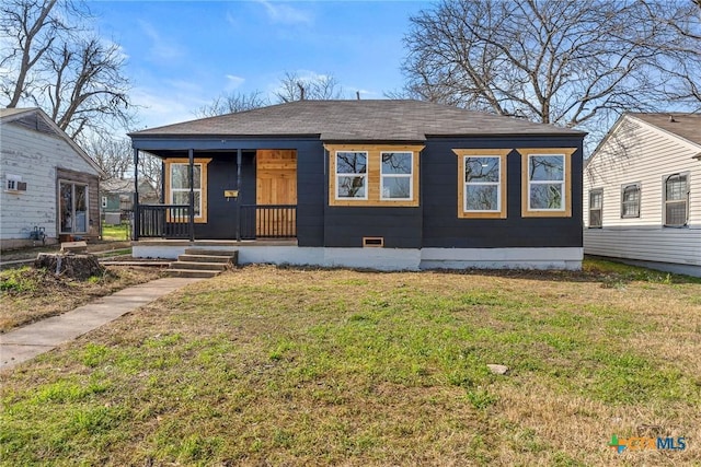 bungalow-style home featuring a front yard and covered porch