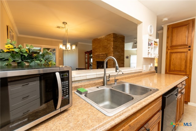 kitchen with stainless steel appliances, sink, crown molding, a notable chandelier, and a brick fireplace