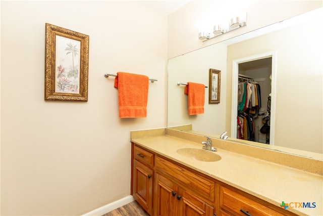 bathroom featuring vanity and hardwood / wood-style flooring