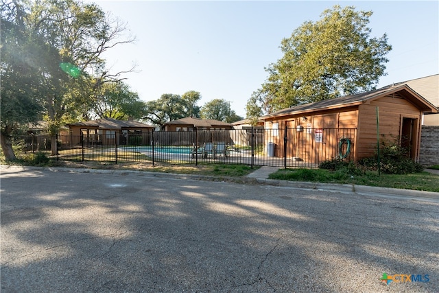 exterior space with a swimming pool