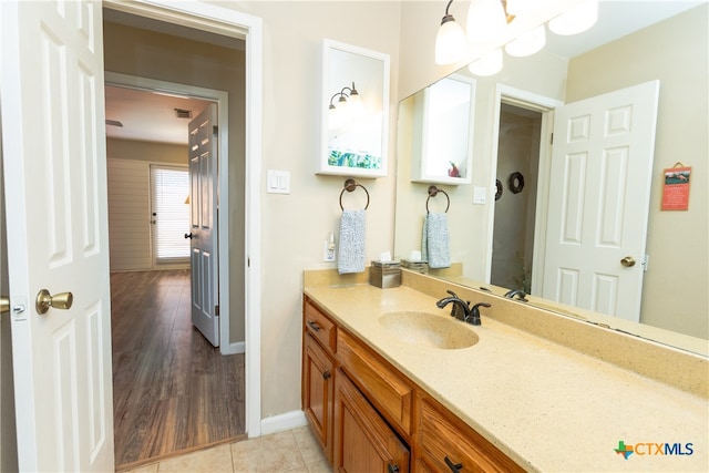 bathroom featuring wood-type flooring and vanity