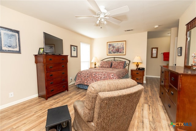 bedroom with light wood-type flooring and ceiling fan