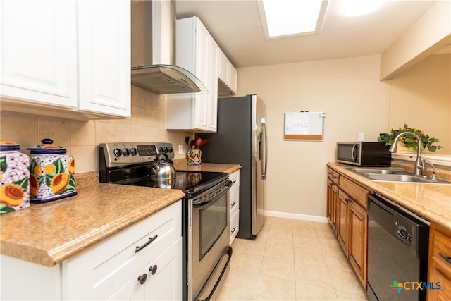 kitchen with tasteful backsplash, stainless steel appliances, white cabinetry, sink, and wall chimney exhaust hood