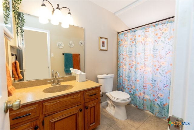 bathroom featuring toilet, vanity, and tile patterned floors