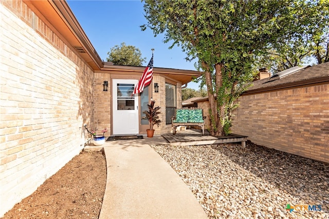 doorway to property with a patio