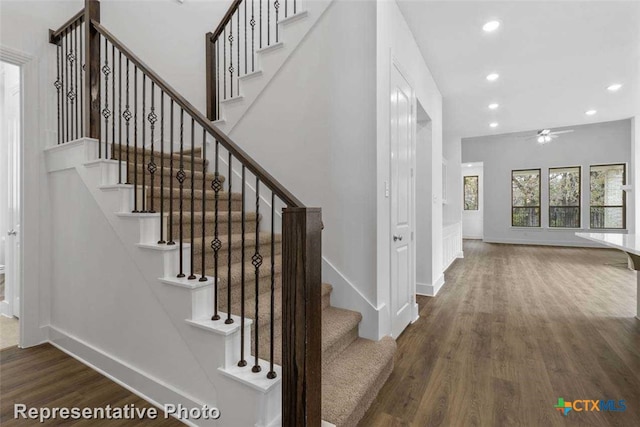 staircase featuring hardwood / wood-style flooring