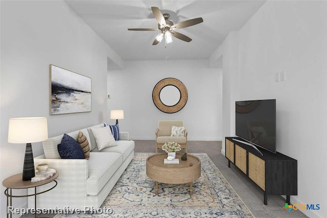 carpeted living room with ceiling fan